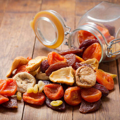 Mix of dried fruits on wooden table