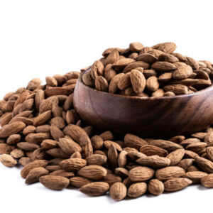 Almonds in wooden bowl isolated on white