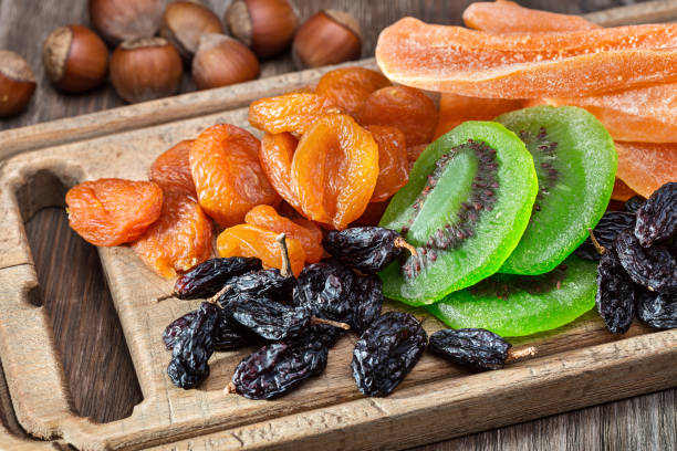 Dried fruits and nuts. still life on wooden board. close up, wooden surface.